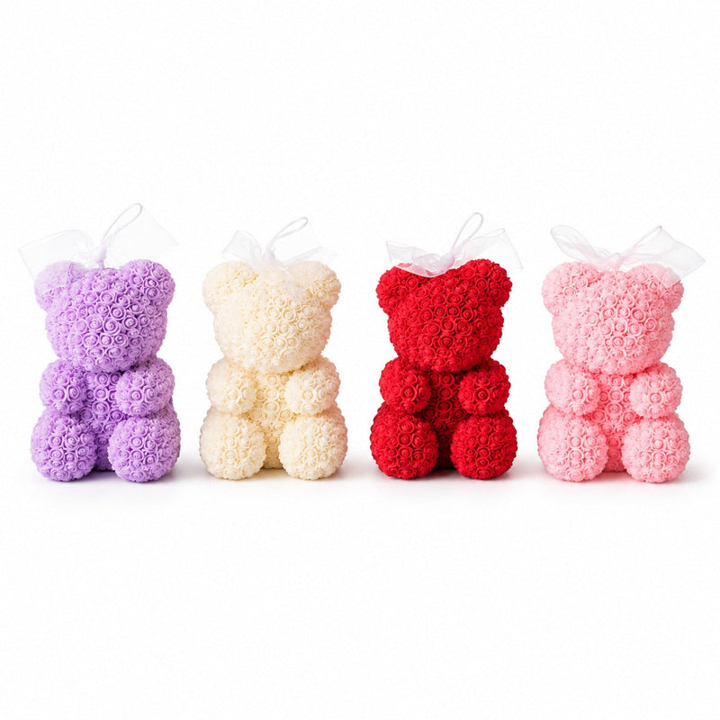 Cute teddy bear candles arranged in different colors and decorative styles.